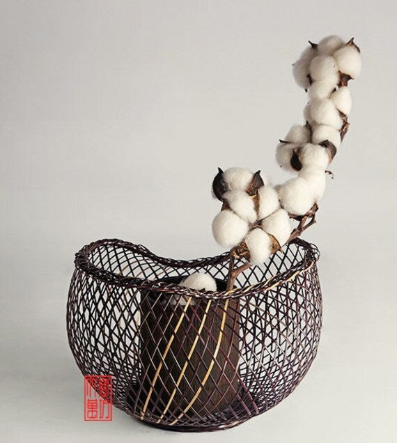 This is a bamboo weaving vase flower arrangement utensil