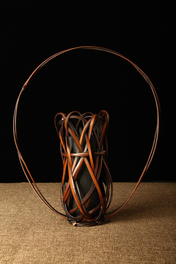 This is a bamboo weaving vase flower utensil