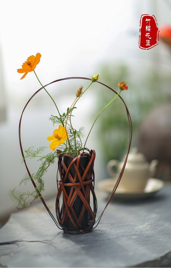 This is a bamboo weaving vase flower utensil