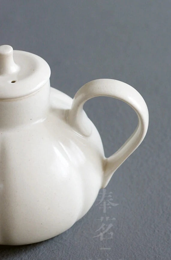 This is a wood ash glaze kettle