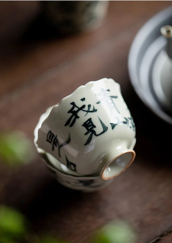 This is a ceramic teacup.this is wood ash glaze teacup