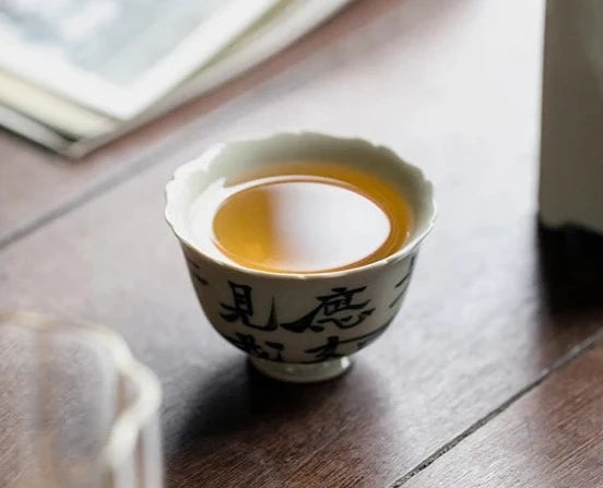 This is a ceramic teacup.this is wood ash glaze teacup