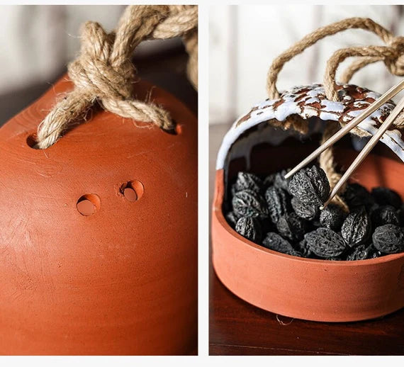 This is a pottery charcoal bowl