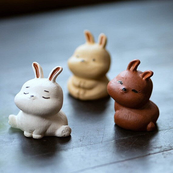 This is a Yixing purple clay rabbit teapet