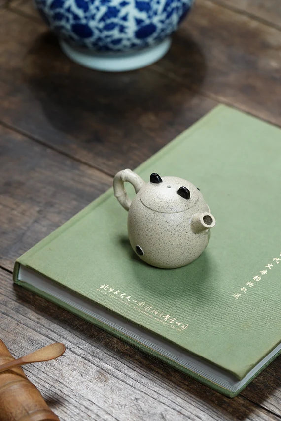 This is a pottery teapot