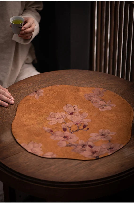 This is a silk brocade tea mat.this is a waterproof table cloth