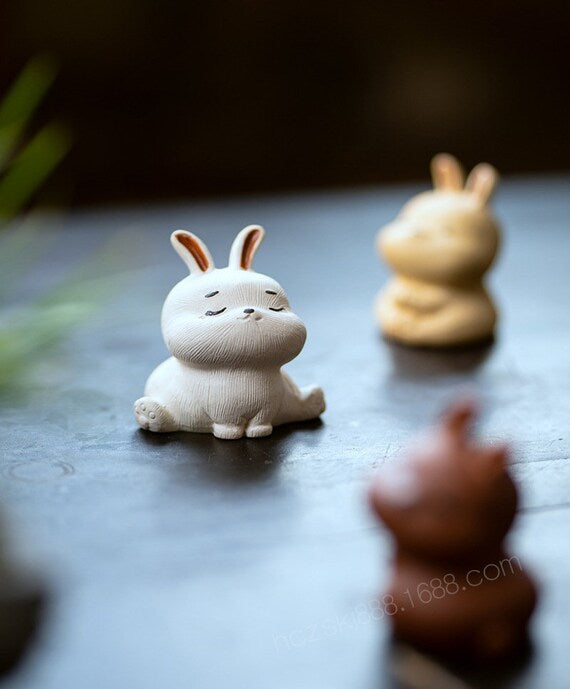 This is a Yixing purple clay rabbit teapet