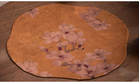 This is a silk brocade tea mat.this is a waterproof table cloth