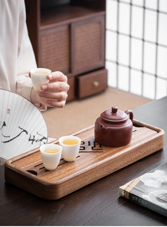 this is a walnut tea tray tea boat