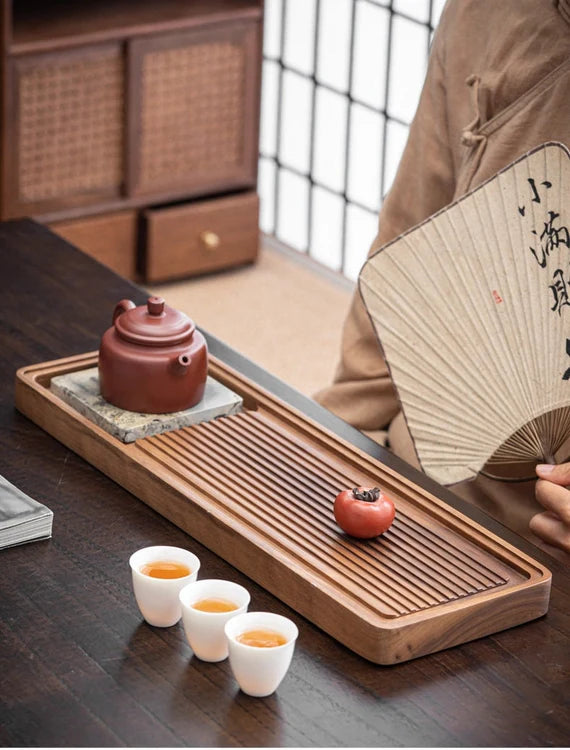 this is a walnut tea tray tea boat