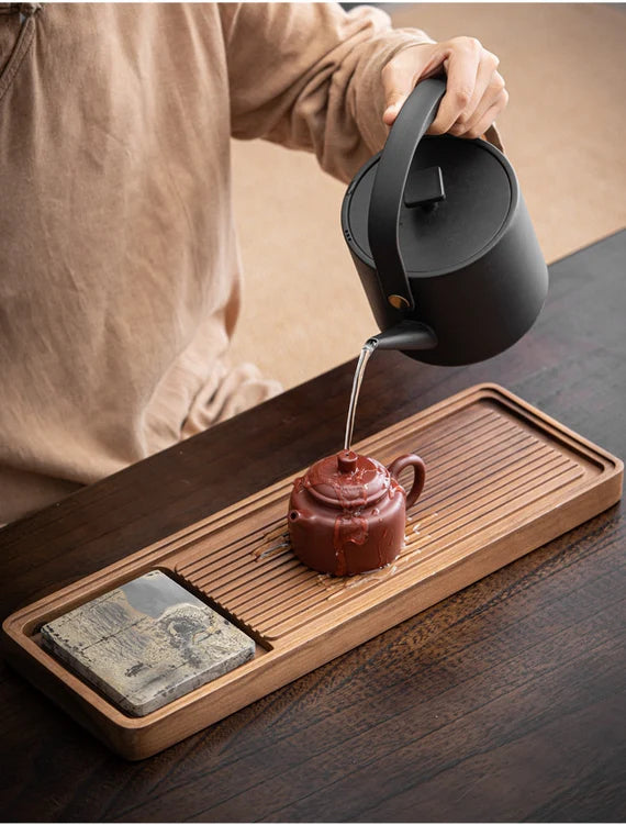 this is a walnut tea tray tea boat