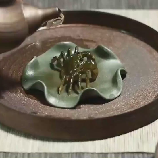 This is a Yixing clay color changing crab teapet