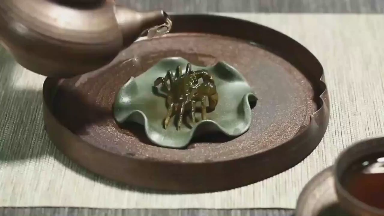 This is a Yixing clay color changing crab teapet