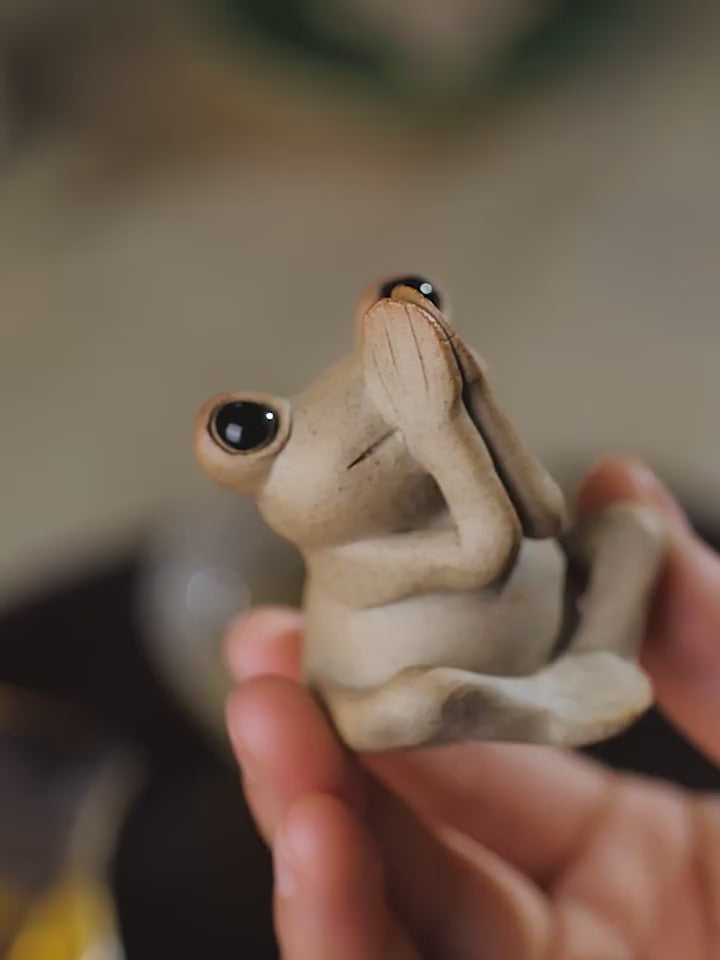 This is a pottery frog teapet