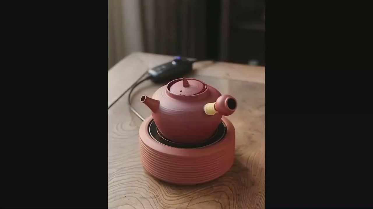 This is a pottery side handle kettle