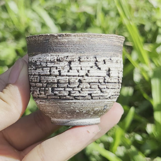 This is a pottery teacup