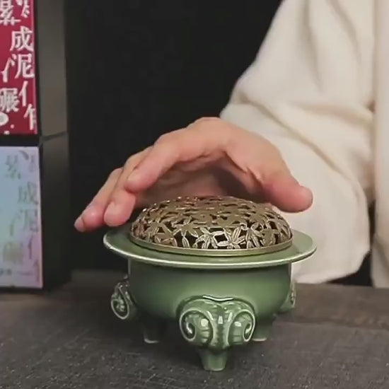 This is a Yue kiln celadon incense burner