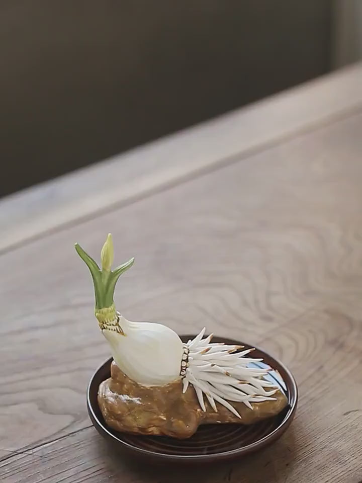 This is a ceramic flower incense holder