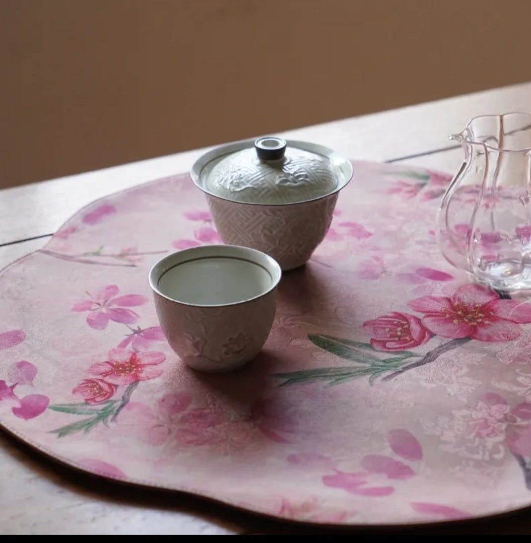 This is a silk brocade tea mat.this is a waterproof table cloth