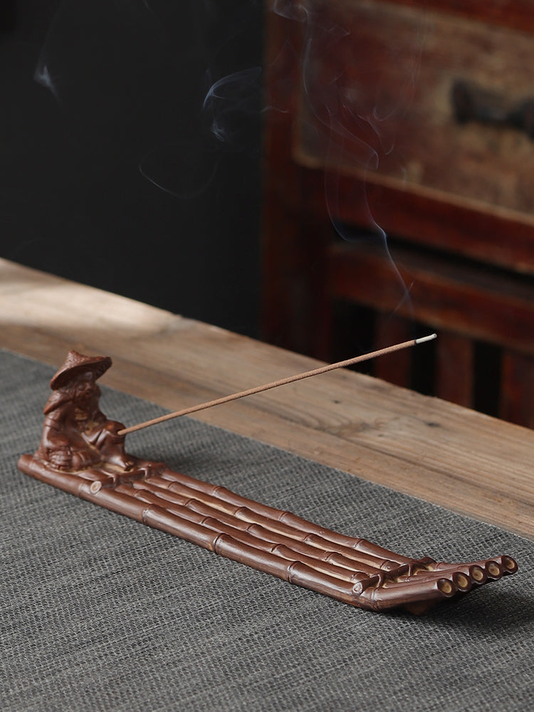 This is a ceramic incense holder