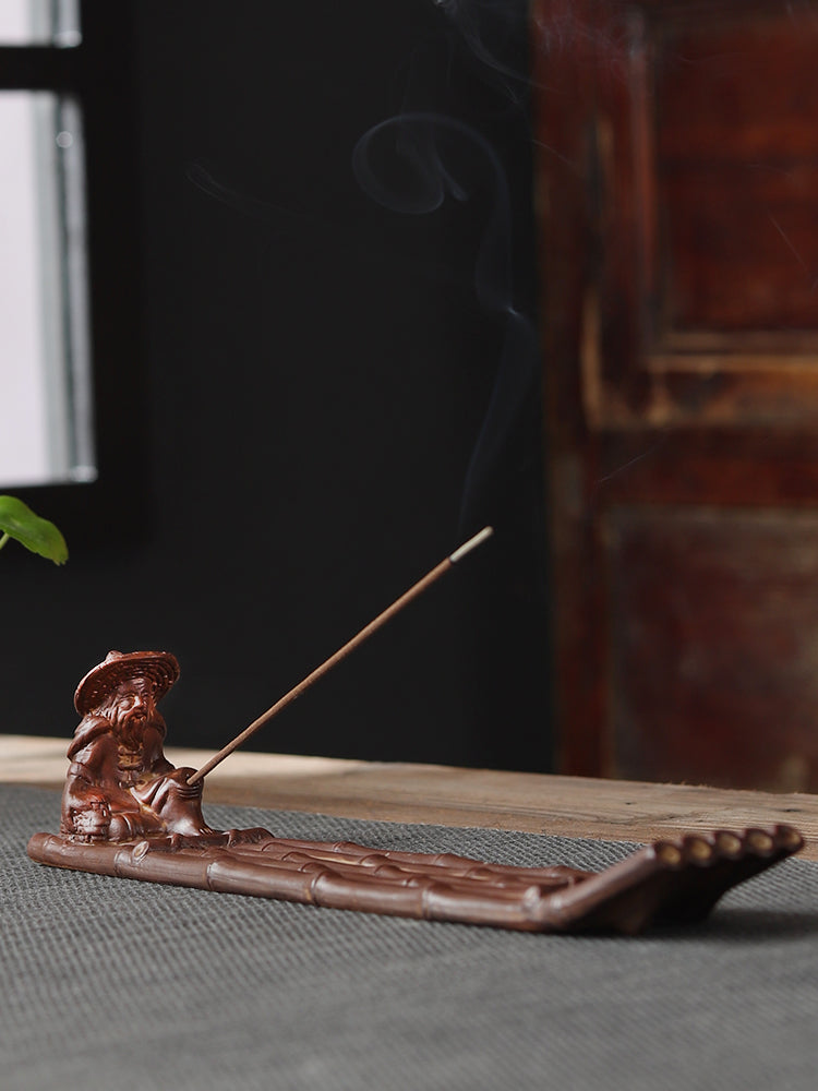 This is a ceramic incense holder