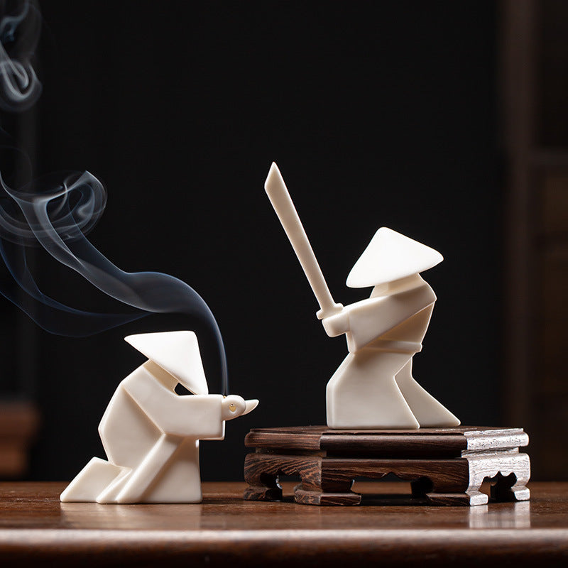 This is a ceramic incense holder tea pet