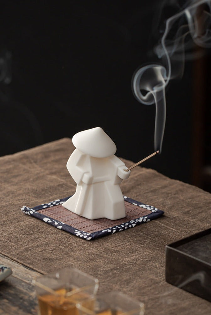 This is a ceramic incense holder tea pet