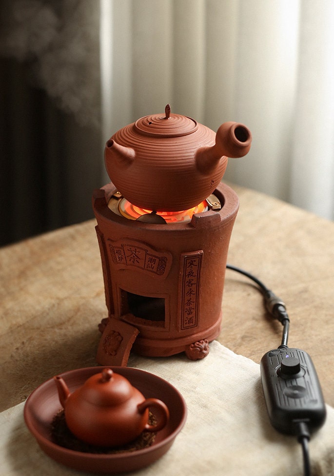 This is an electric charcoal stove. this is a chaozhou clay pottery stove 