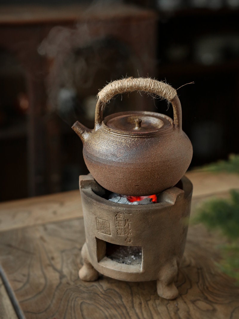 This is a pottery lifting handle kettle 