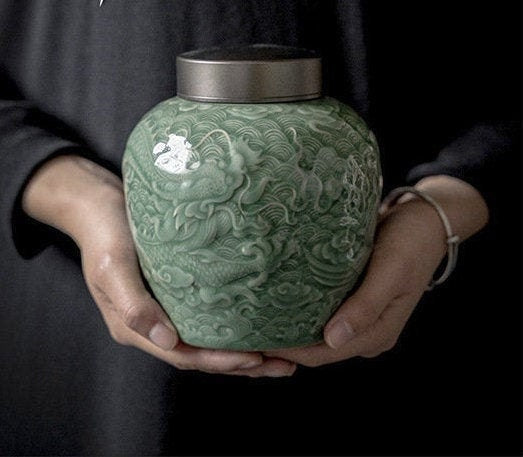 this is a celadon tea jar.this is a green ceramic tea storage canister