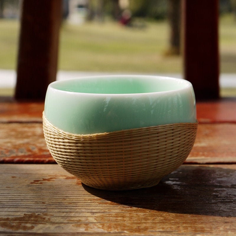 This is a bamboo woven teacup.this is a ceramic teacup