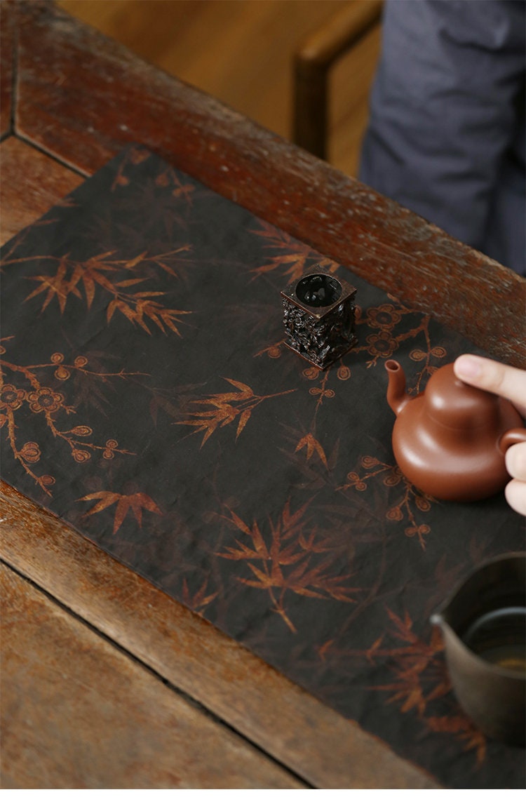 This is a gambiered canton silk xiangyunsha tea table cloth