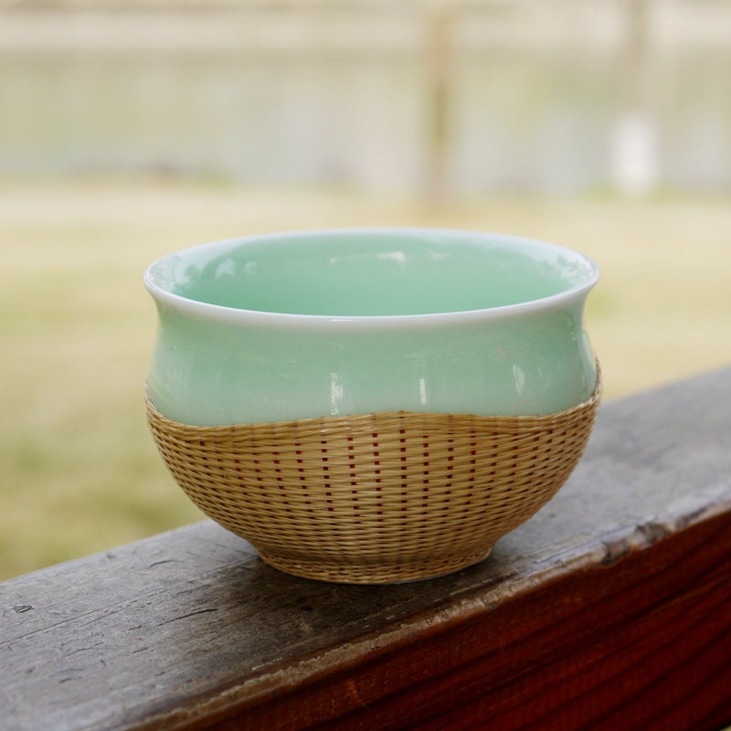 This is a bamboo woven teacup.this is a ceramic teacup