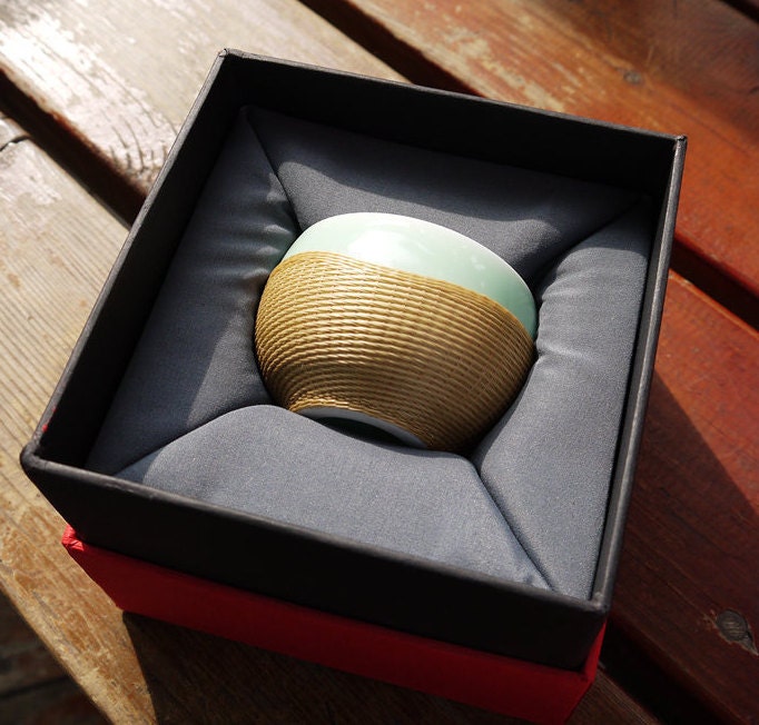 This is a bamboo woven teacup.this is a ceramic teacup