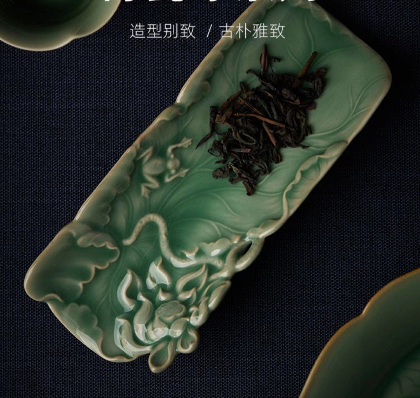 This is a green celadon ceramic tea scoop