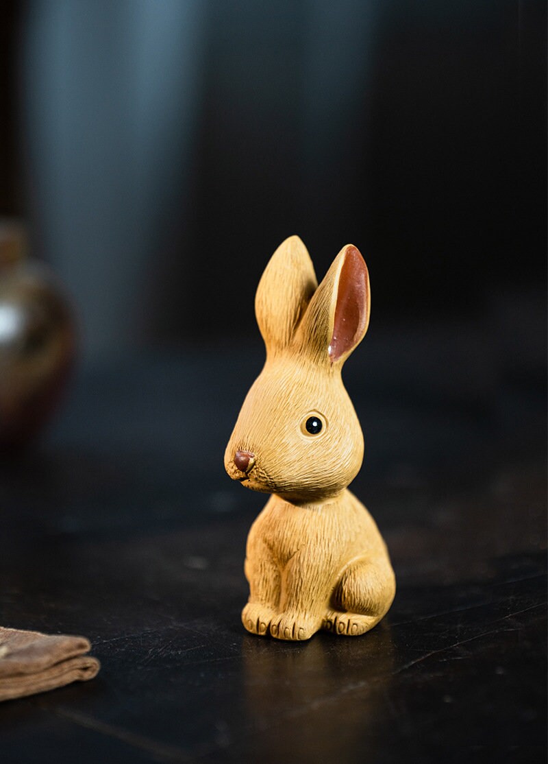 This is a Yixing purple clay rabbit teapet