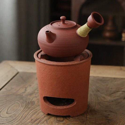 This is a pottery side handle kettle