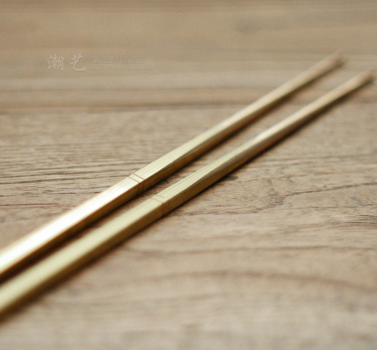 This is a brass copper chopsticks 