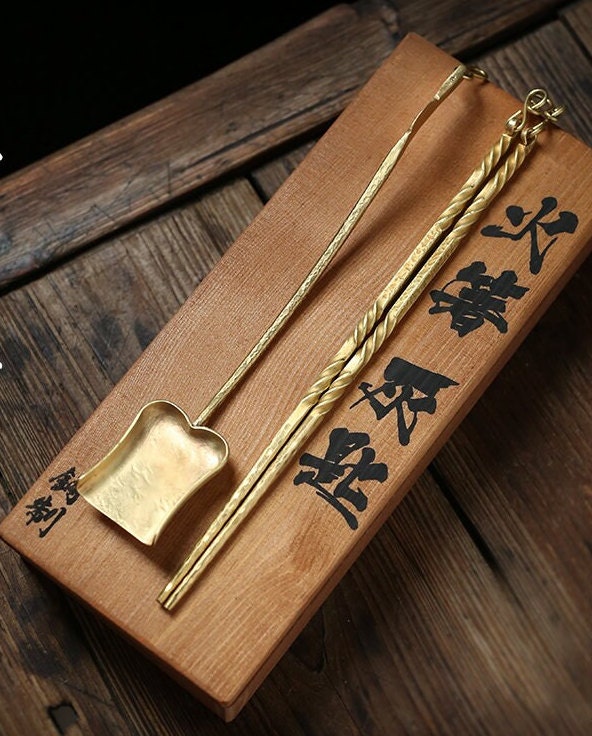 This is a brass copper chopsticks set