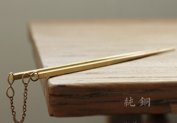 This is a brass copper chopsticks 