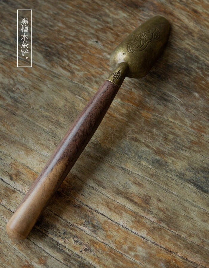 This is a wooden tea scoop