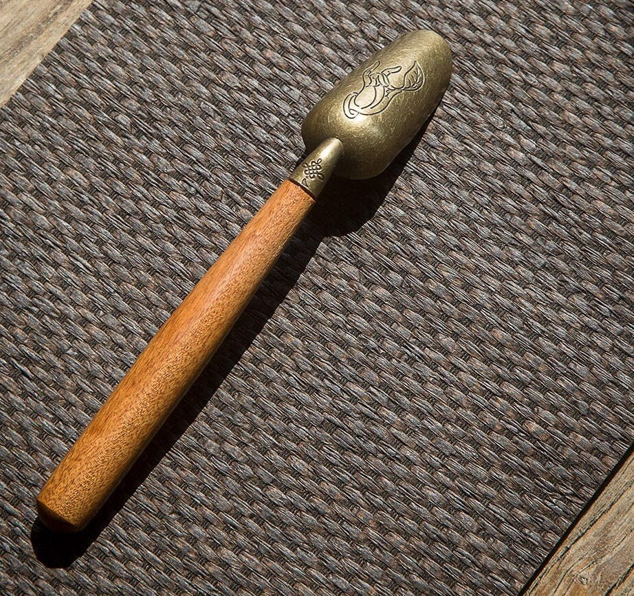 This is a wooden tea scoop