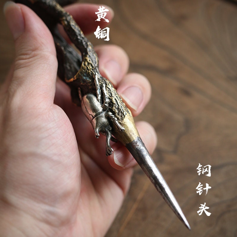 This is a brass copper puerh cake knife tea knife tea needles