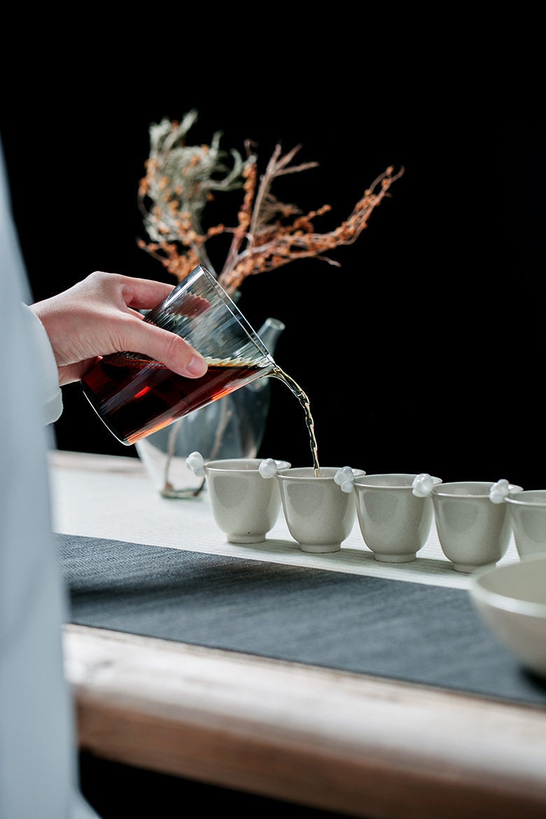 This is a transparent black glass faircup gongdaobei