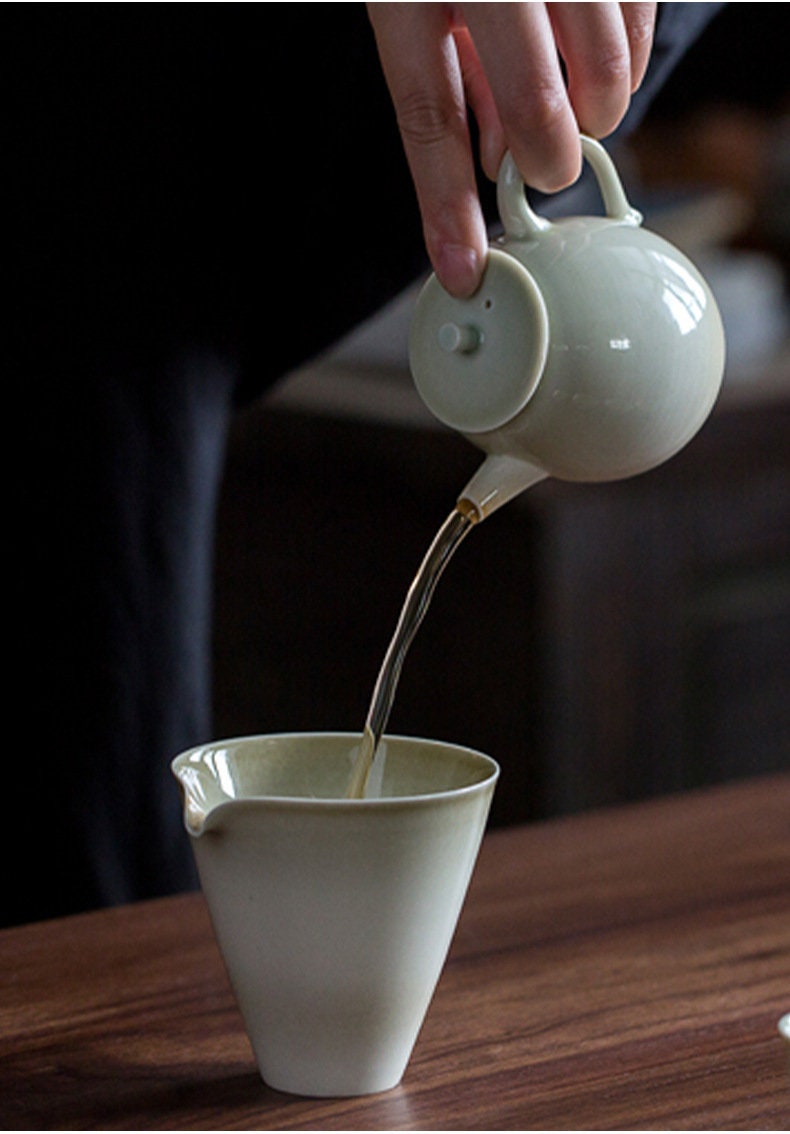 this is a wood ash glazed teapot.this is a ceramic teapot