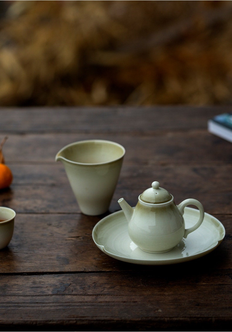 this is a wood ash glazed teapot.this is a ceramic teapot