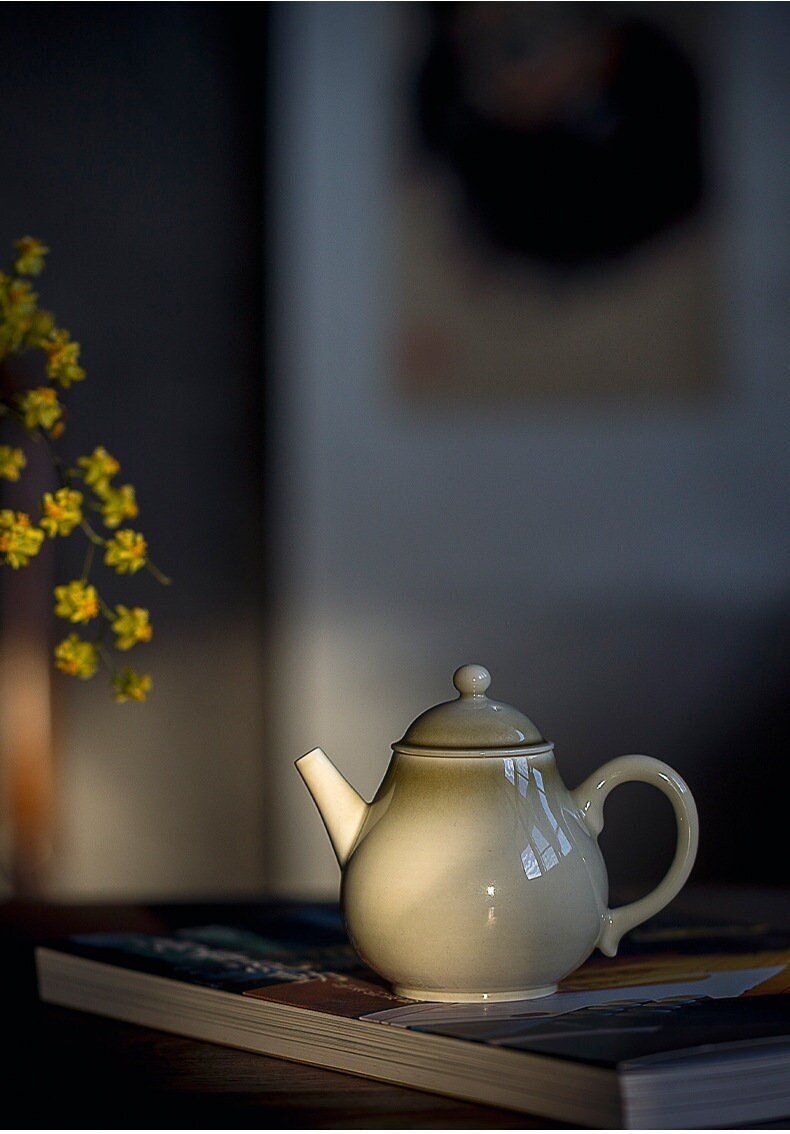 this is a wood ash glazed teapot.this is a ceramic teapot