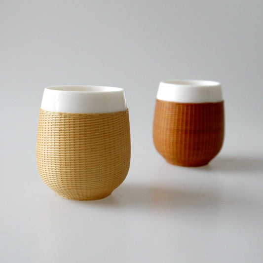 This is a bamboo woven teacup.this is a ceramic teacup