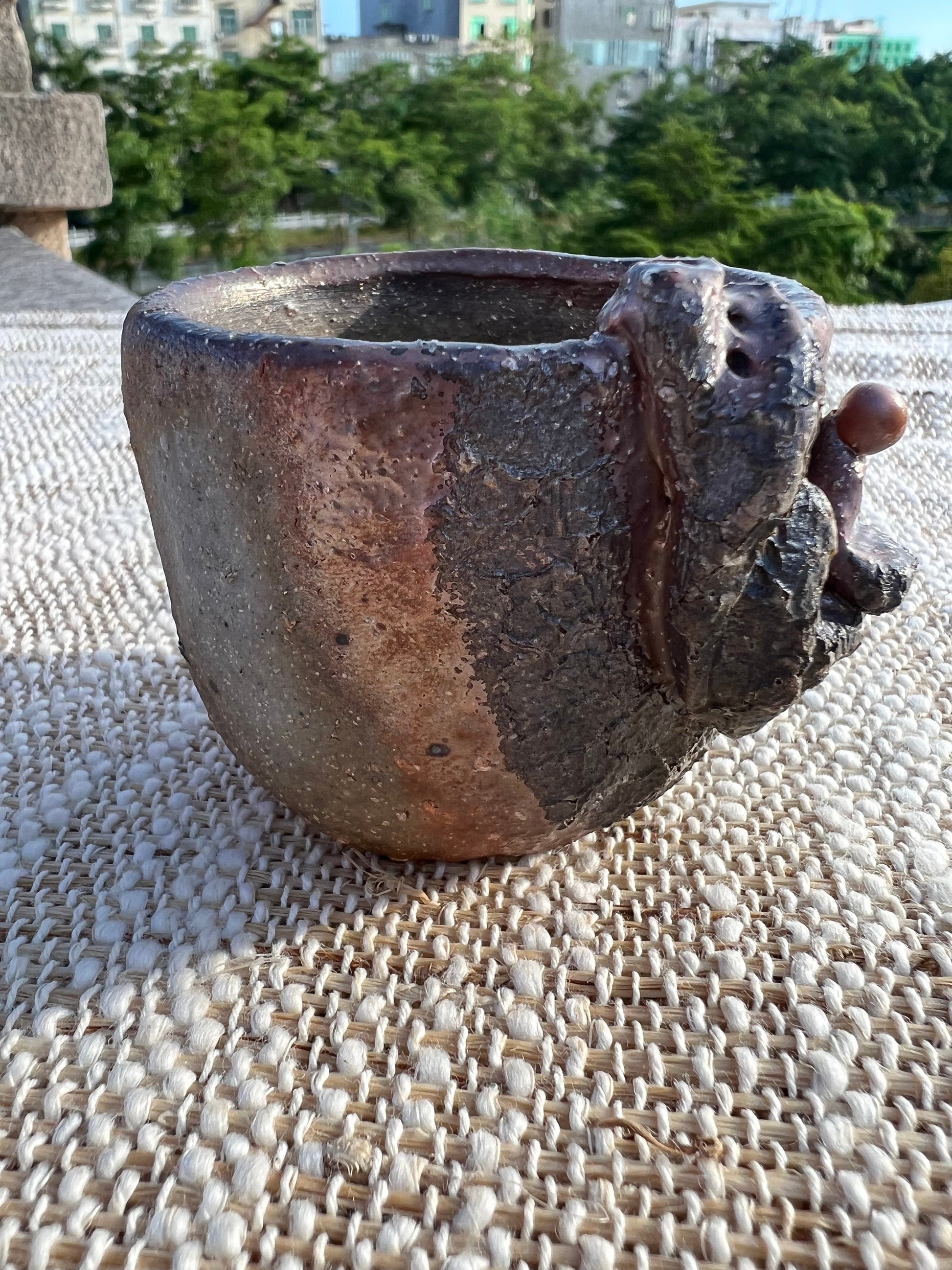 This is a woodfired pottery teacup