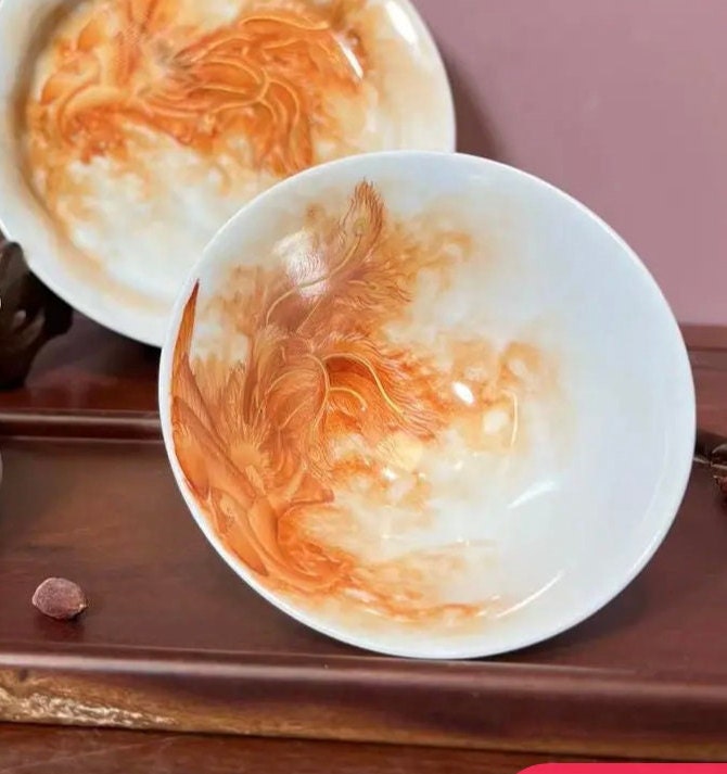 this is a Chinese Jingdezhen alum red phoenix teacup.this is a ceramic teacup